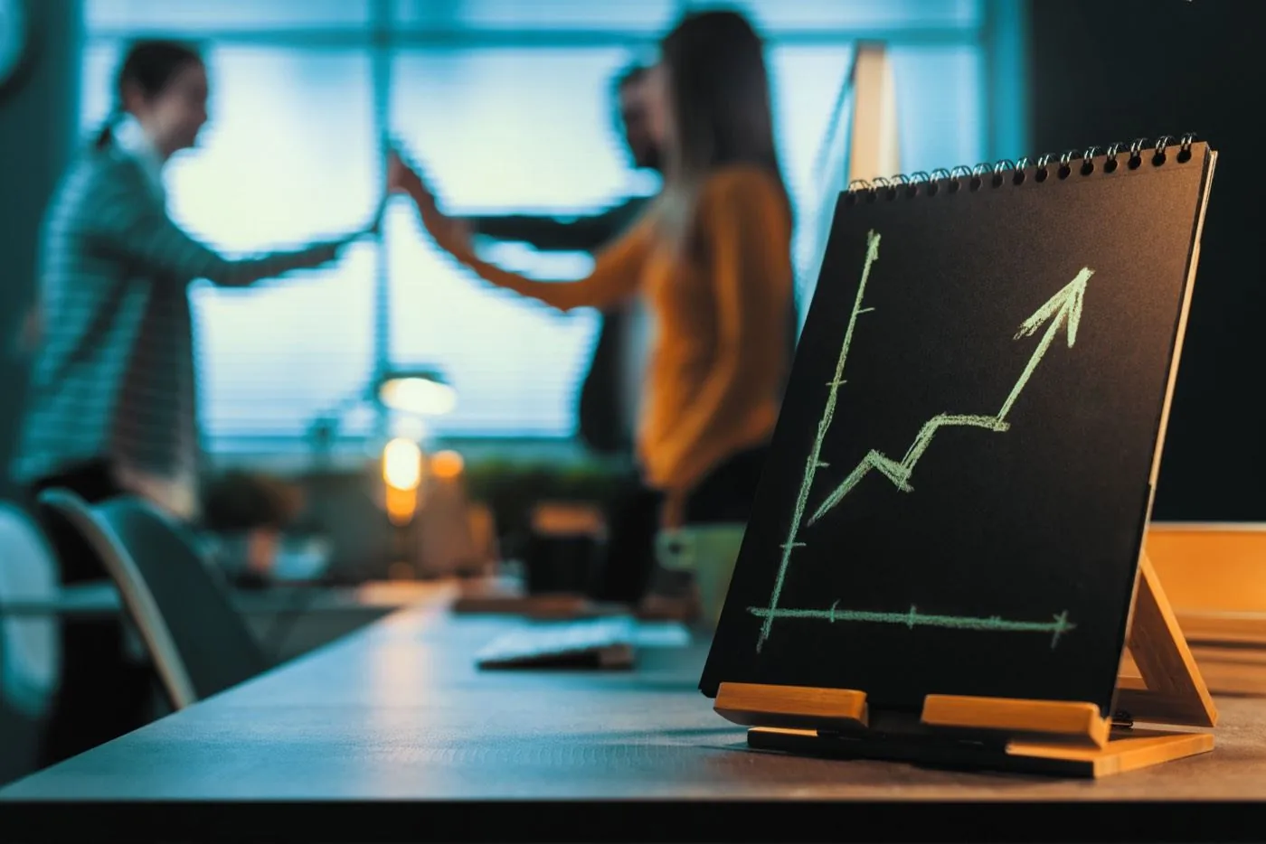 A team celebrating business growth